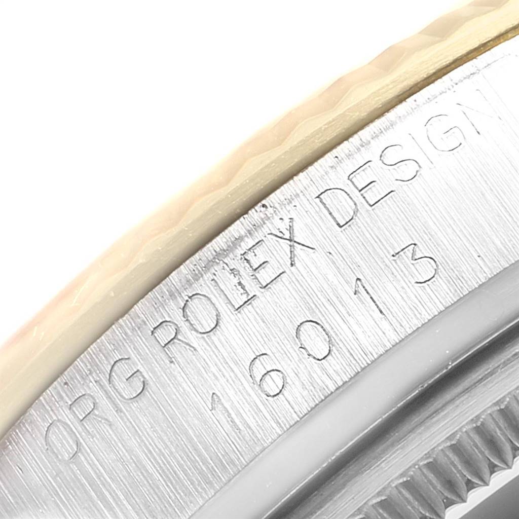 This image shows a close-up of the side casing of a Rolex Vintage Collection 16013 Men's Stainless Steel Champagne Dial 16013 Men's Stainless Steel Champagne Dial model, displaying the model number and brand engraving.