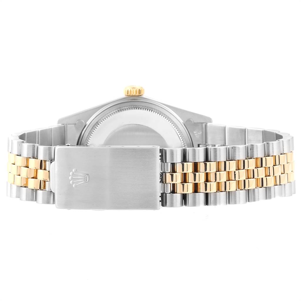 This Rolex Vintage Collection 16013 Men's Stainless Steel Champagne Dial 16013 Men's Stainless Steel Champagne Dial watch is shown from the rear angle, highlighting the clasp, case back, and two-tone bracelet.