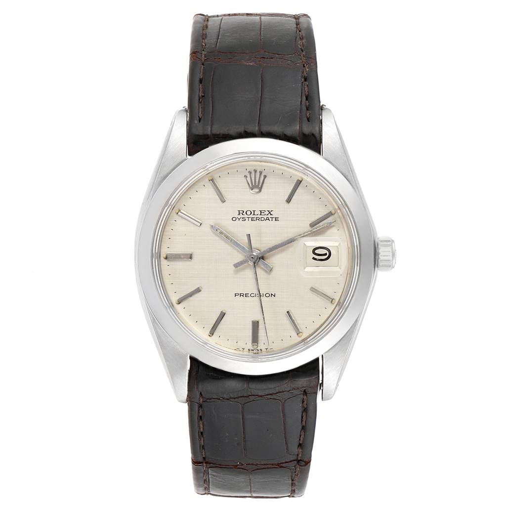 The image shows a frontal view of a Rolex Vintage Collection 6694 Men's Stainless Steel Silver Dial 6694 Men's Stainless Steel Silver Dial Oysterdate watch with a beige dial and black leather strap.