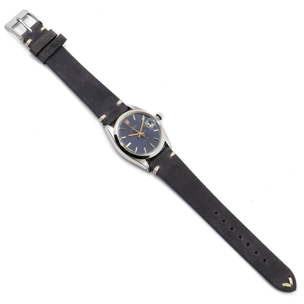 The image shows a Rolex Vintage Collection 6694 Men's Stainless Steel Blue Dial 6694 Men's Stainless Steel Blue Dial model watch from a top view, displaying its face, strap, and buckle.