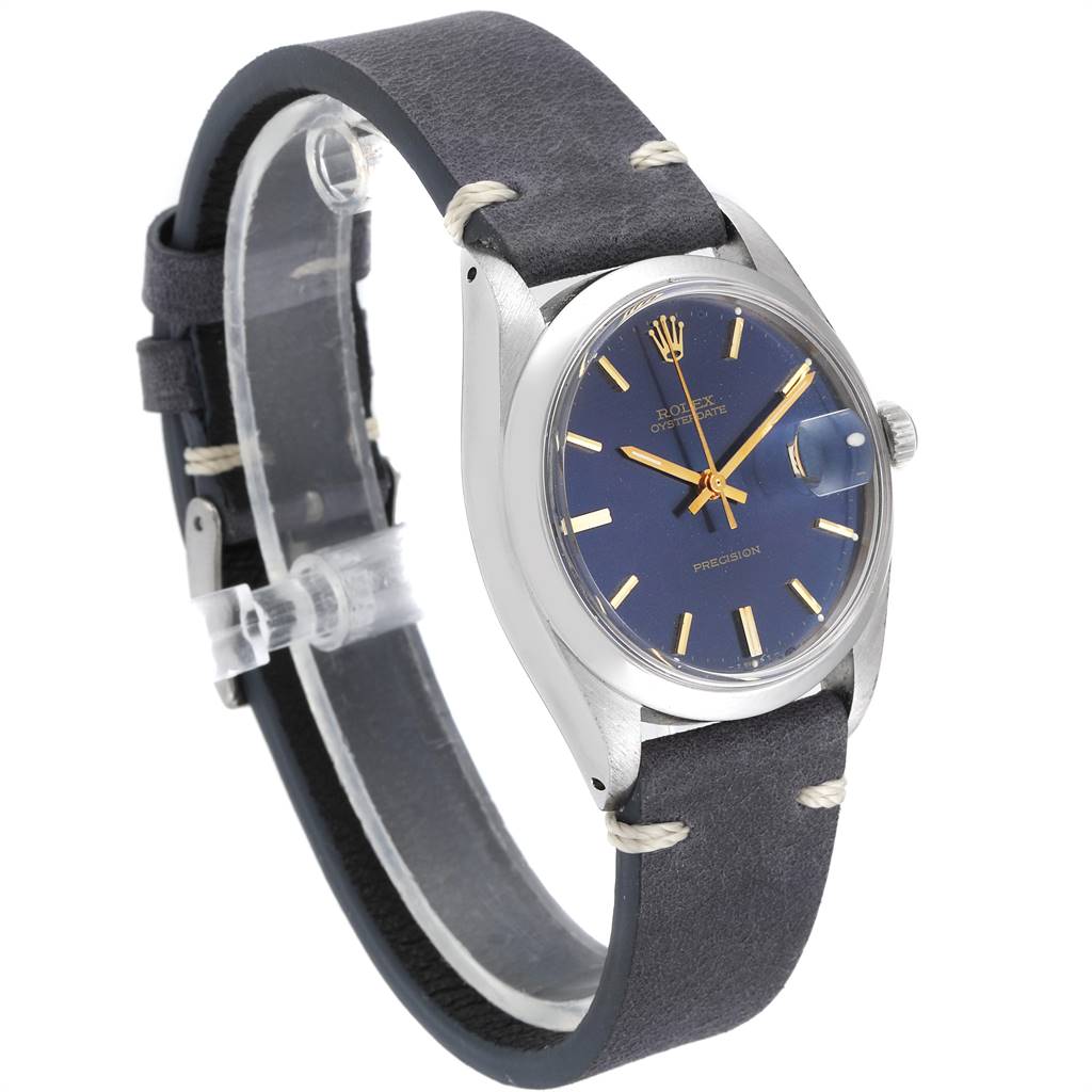 The image shows a Rolex Vintage Collection 6694 Men's Stainless Steel Blue Dial 6694 Men's Stainless Steel Blue Dial watch at an angled view, highlighting its blue dial, gold markers, and leather strap.