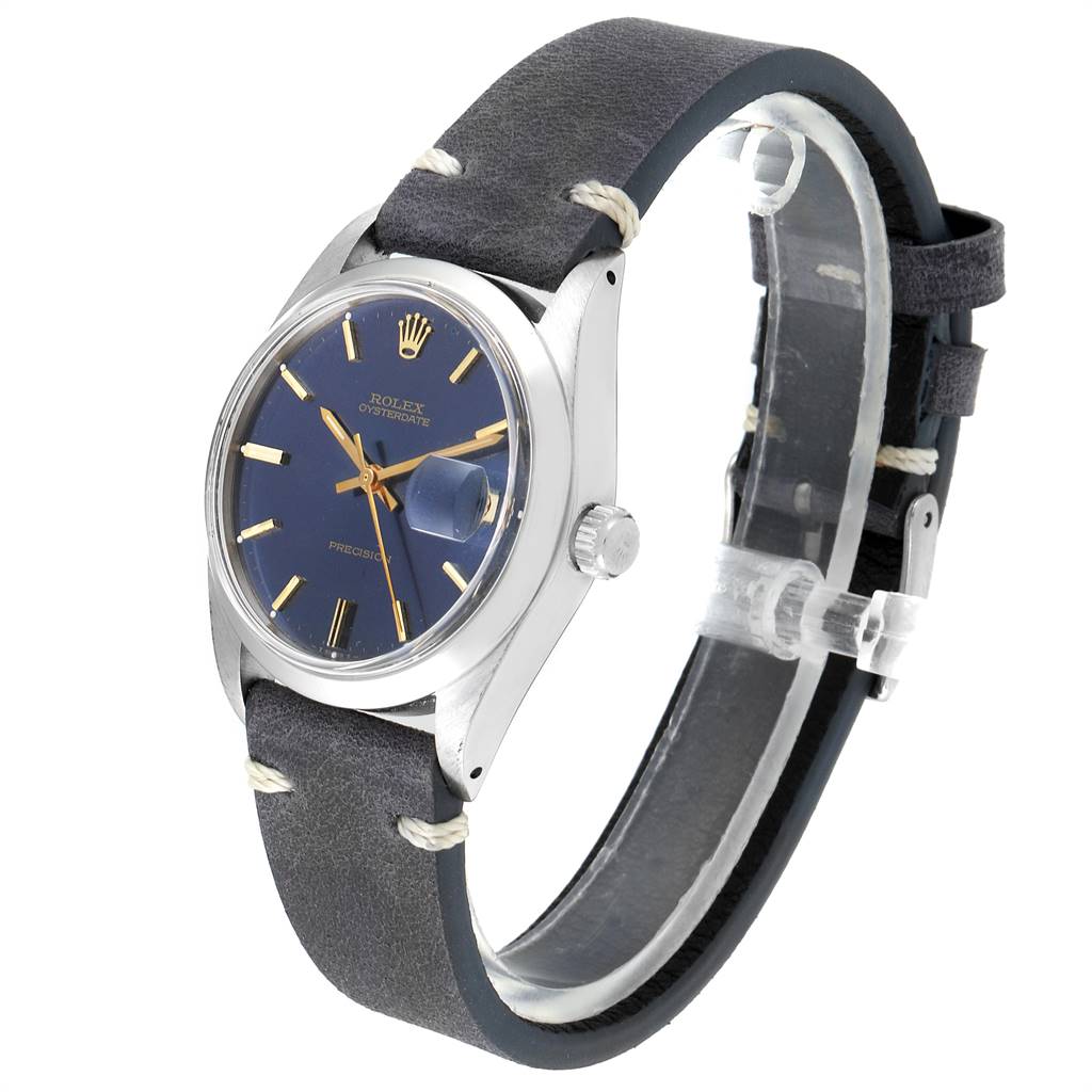 The Rolex Vintage Collection 6694 Men's Stainless Steel Blue Dial 6694 Men's Stainless Steel Blue Dial watch is shown from an angled side view, displaying the face, crown, and leather strap.