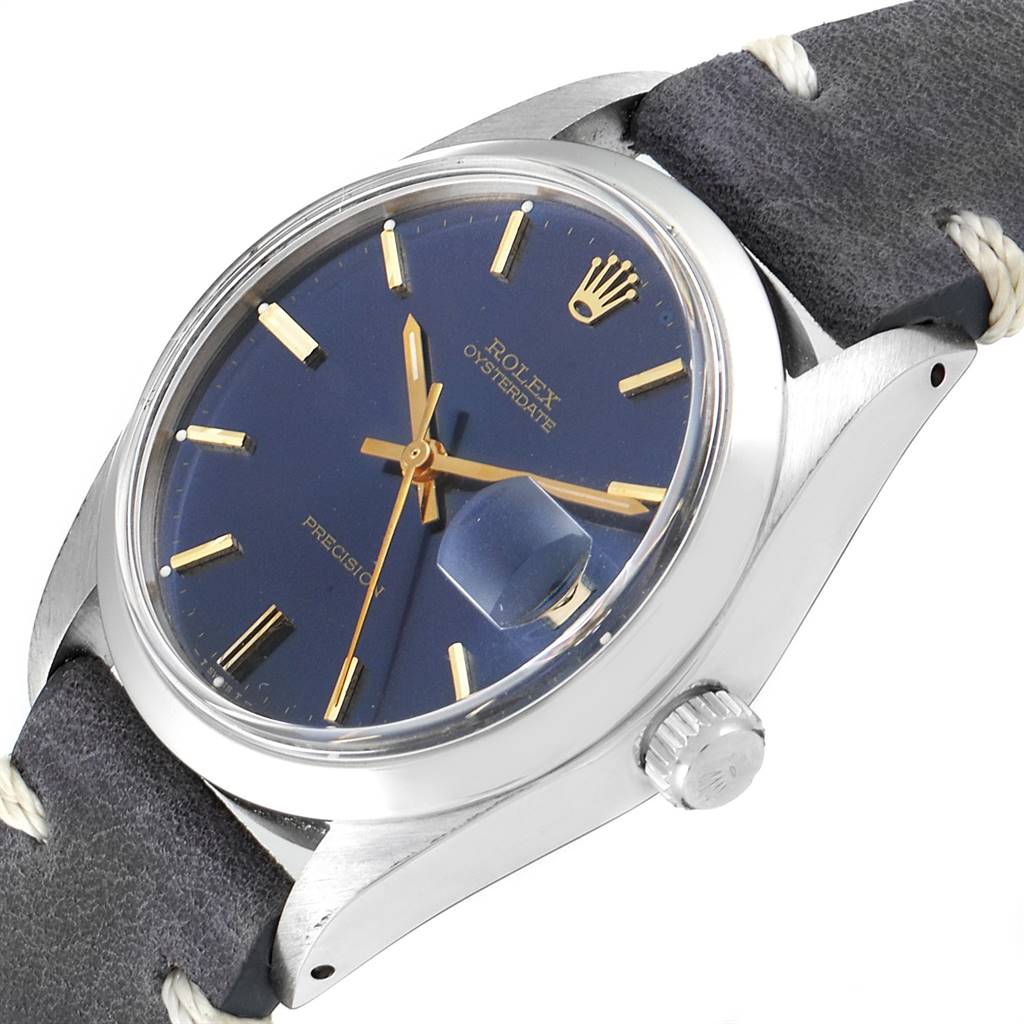 The image shows a side angle of the Rolex Vintage Collection 6694 Men's Stainless Steel Blue Dial 6694 Men's Stainless Steel Blue Dial watch, highlighting the dial, crown, case, and strap.