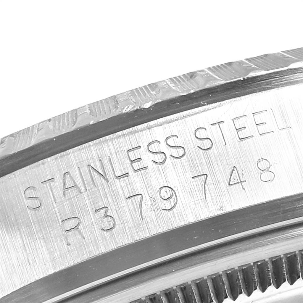 The image shows a close-up view of the caseback edge of the Rolex Vintage Collection 16030 Men's Stainless Steel Grey Dial 16030 Men's Stainless Steel Grey Dial watch, highlighting the stainless steel material and model number.