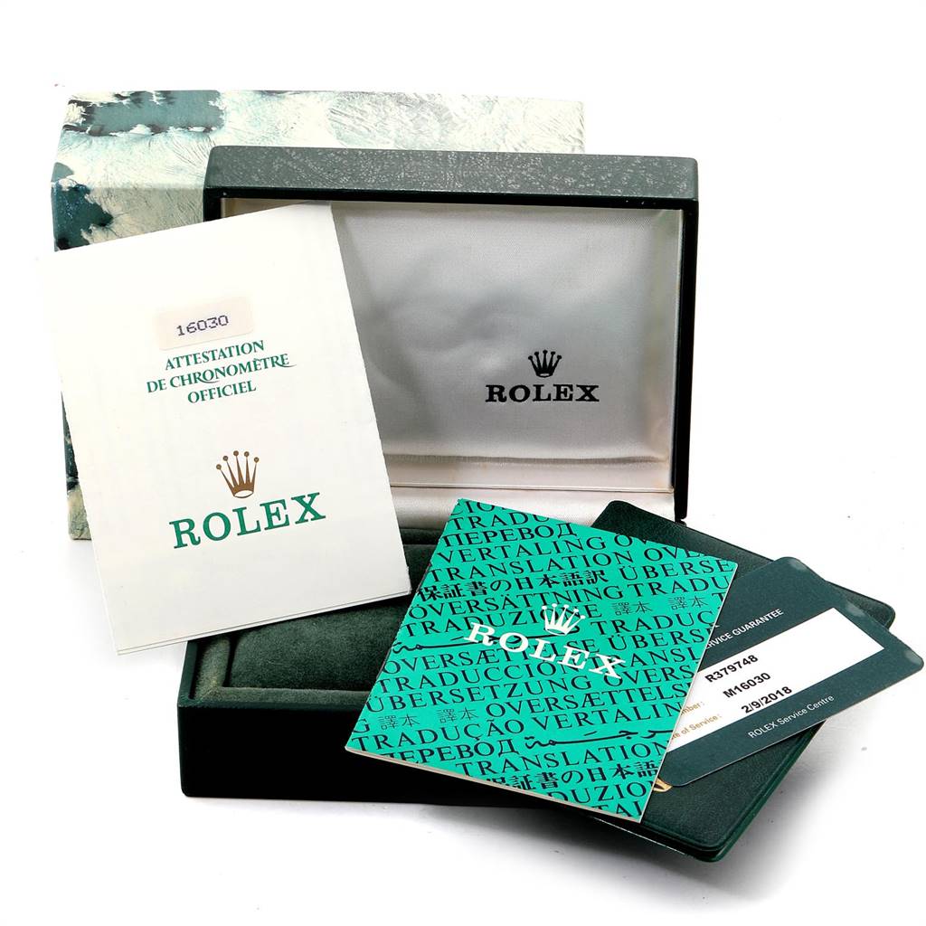 The image shows a Rolex Vintage Collection 16030 Men's Stainless Steel Grey Dial 16030 Men's Stainless Steel Grey Dial watch box with official attestation papers and other documentation.