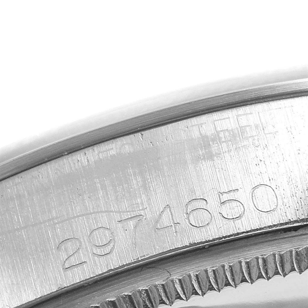 This close-up image shows the engraved serial number on the bezel of a Rolex Vintage Collection 5500 Men's Stainless Steel Silver Dial 5500 Men's Stainless Steel Silver Dial watch.
