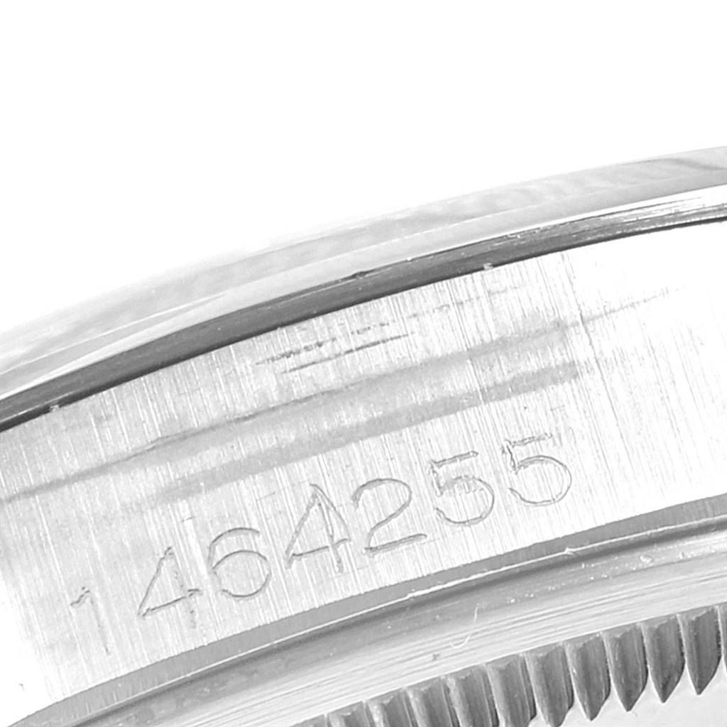 The image shows a close-up of the side casing and serial number of the Rolex Vintage Collection 1500 Men's Stainless Steel Silver Dial 1500 Men's Stainless Steel Silver Dial watch.
