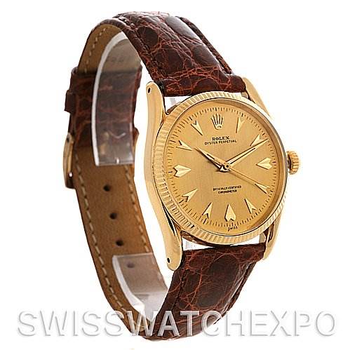 The Rolex Vintage Collection 6593 Men's Yellow Gold Champagne Dial 6593 Men's Yellow Gold Champagne Dial watch is shown at a three-quarter angle, displaying its brown leather strap and the gold dial.