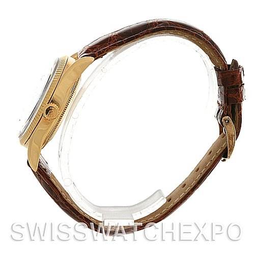 The image shows a side view of the Rolex Vintage Collection 6593 Men's Yellow Gold Champagne Dial 6593 Men's Yellow Gold Champagne Dial watch, displaying its case, crown, and brown leather strap.