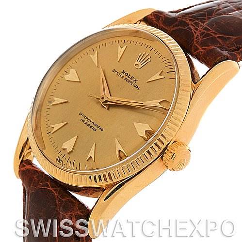 The image shows a Rolex Vintage Collection 6593 Men's Yellow Gold Champagne Dial 6593 Men's Yellow Gold Champagne Dial model watch from a front angle, highlighting its gold dial, bezel, crown, and brown leather strap.