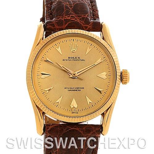 The image shows a frontal view of a Rolex Vintage Collection 6593 Men's Yellow Gold Champagne Dial 6593 Men's Yellow Gold Champagne Dial watch, featuring its dial, hands, and leather strap.