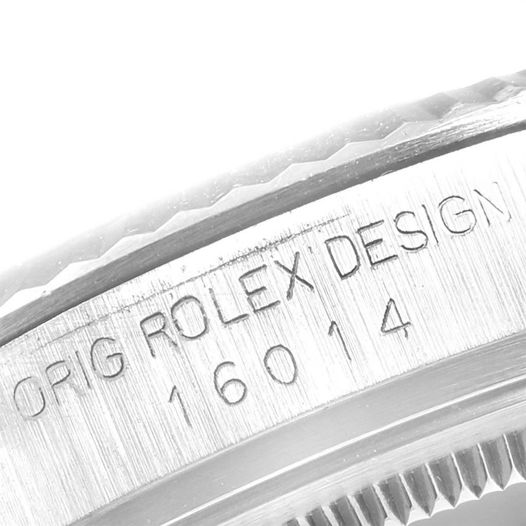 The image shows a close-up of the engraved case and fluted bezel of the Vintage Collection model by Rolex.