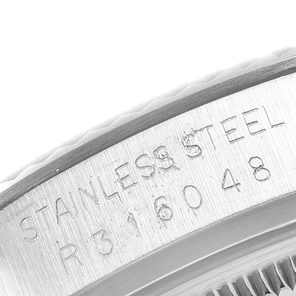 The close-up image shows the engraved stainless steel case back edge of a Vintage Collection Rolex watch.
