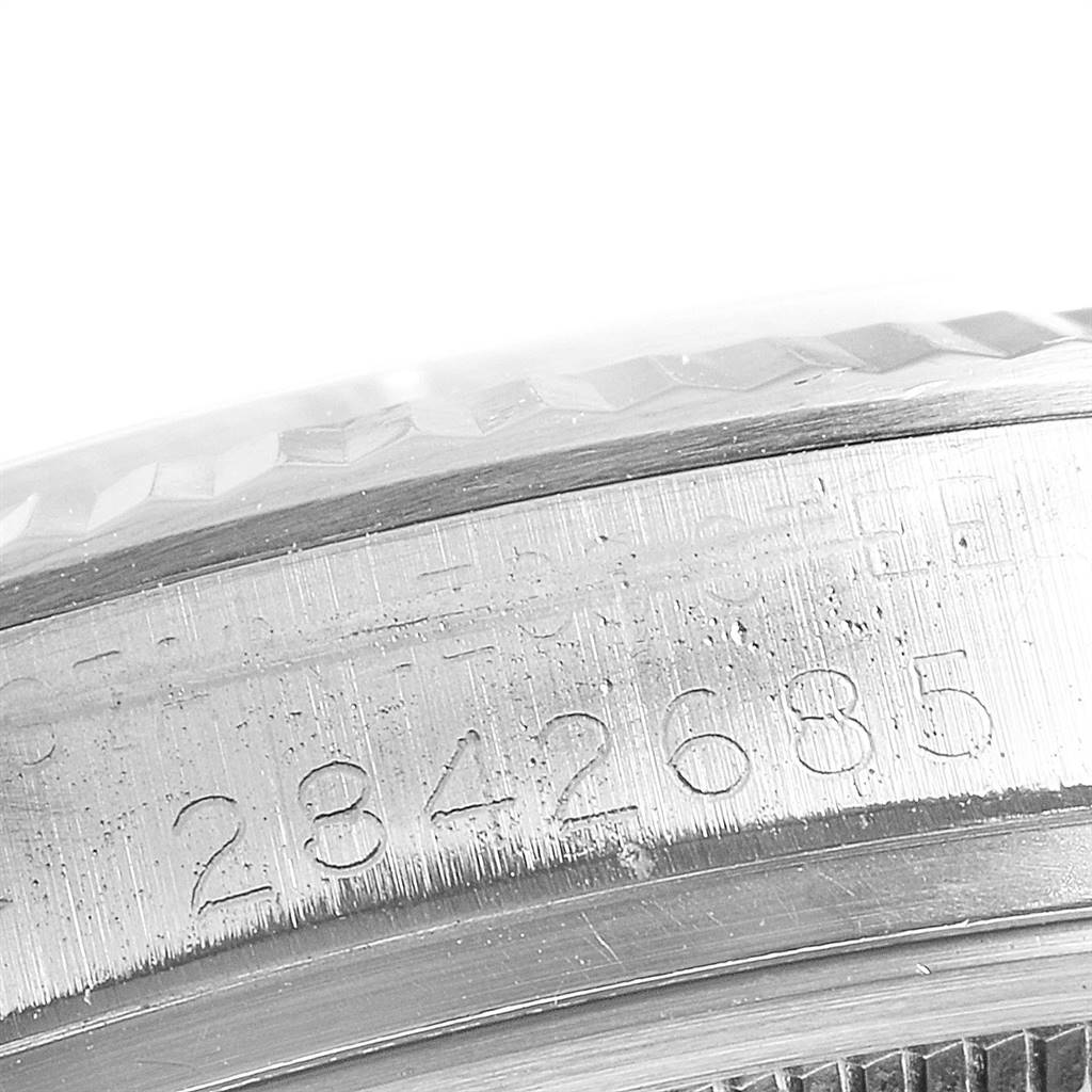 The image shows a close-up of the case edge detailing the serial number of the Vintage Collection model by Rolex.