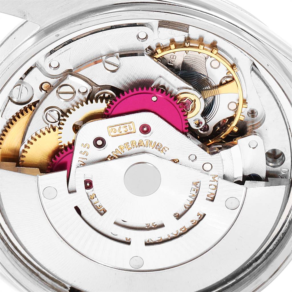 The image shows the intricate internal mechanism of a Vintage Collection model by Rolex, highlighting the gears and movement parts.
