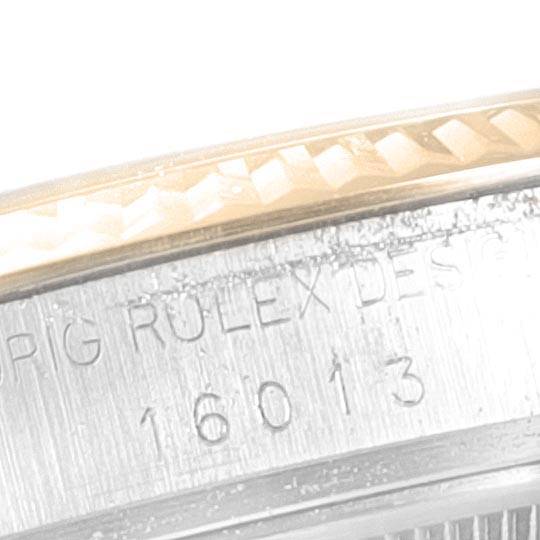 Close-up of the casing edge with the serial number and "Rolex" branding on the Vintage Collection model by Rolex.