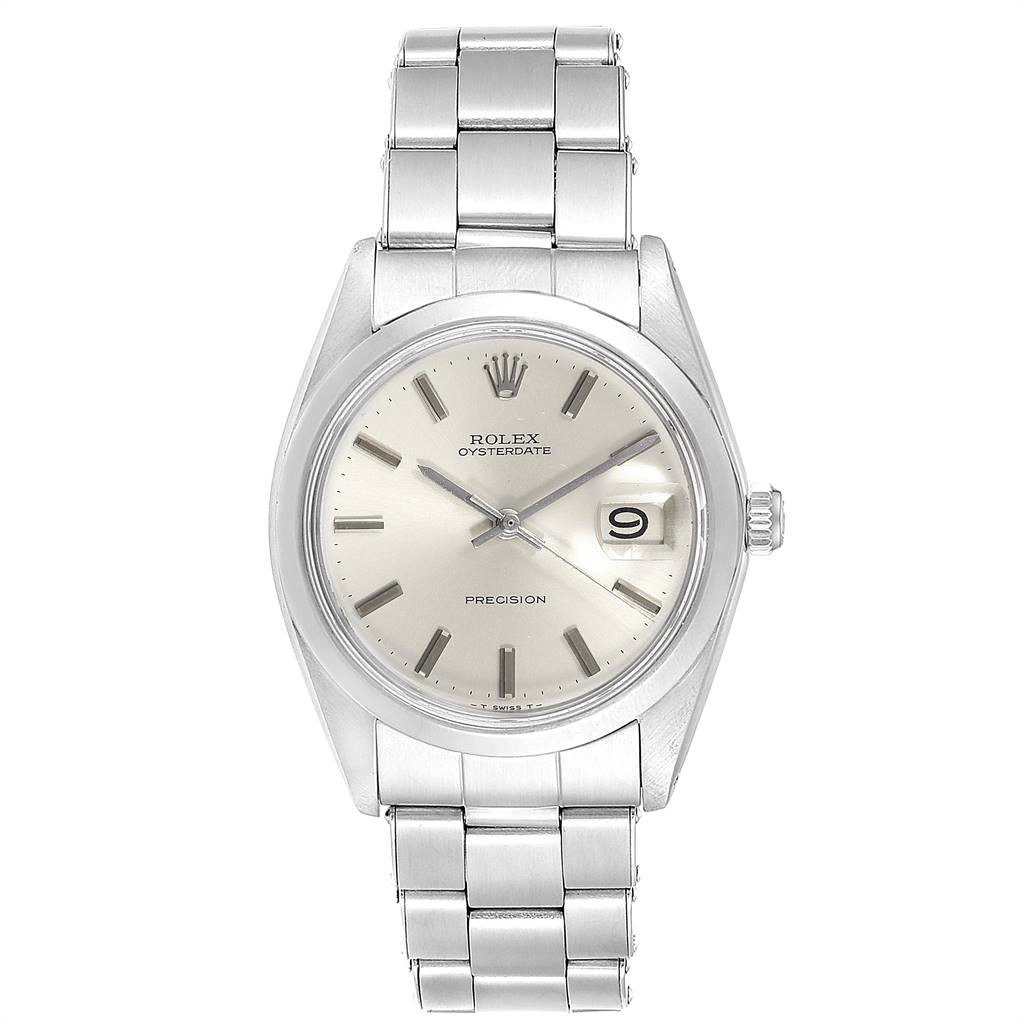 The image shows a front view of a Rolex Oysterdate Precision Vintage Collection watch with a metal bracelet and date display.