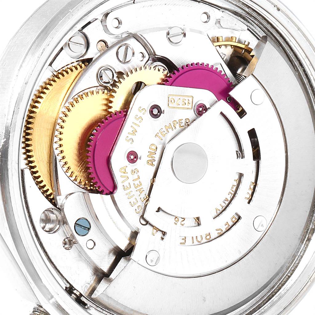 This image shows an internal view of the Vintage Collection Rolex watch mechanism, highlighting gears and movement components.