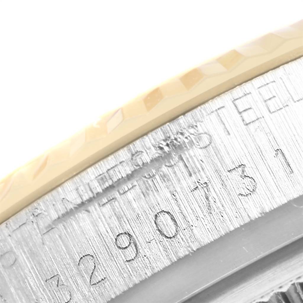 The image shows a close-up of the case side with engravings on a Vintage Collection model by Rolex.