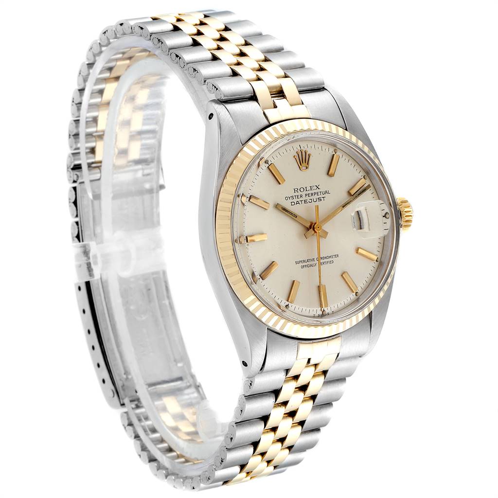 This image shows a side angle of the Rolex Vintage Collection 1601 Men
s Steel and Gold (two tone) Silver Dial 1601 Men
s Steel and Gold (two tone) Silver Dial watch, showcasing the face, bezel, crown, and metal bracelet.