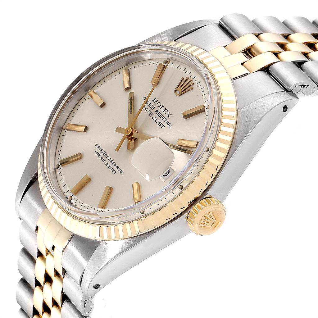 This image shows a close-up angle of the Rolex Vintage Collection 1601 Men
s Steel and Gold (two tone) Silver Dial 1601 Men
s Steel and Gold (two tone) Silver Dial watch, highlighting its dial, crown, bezel, and bracelet.