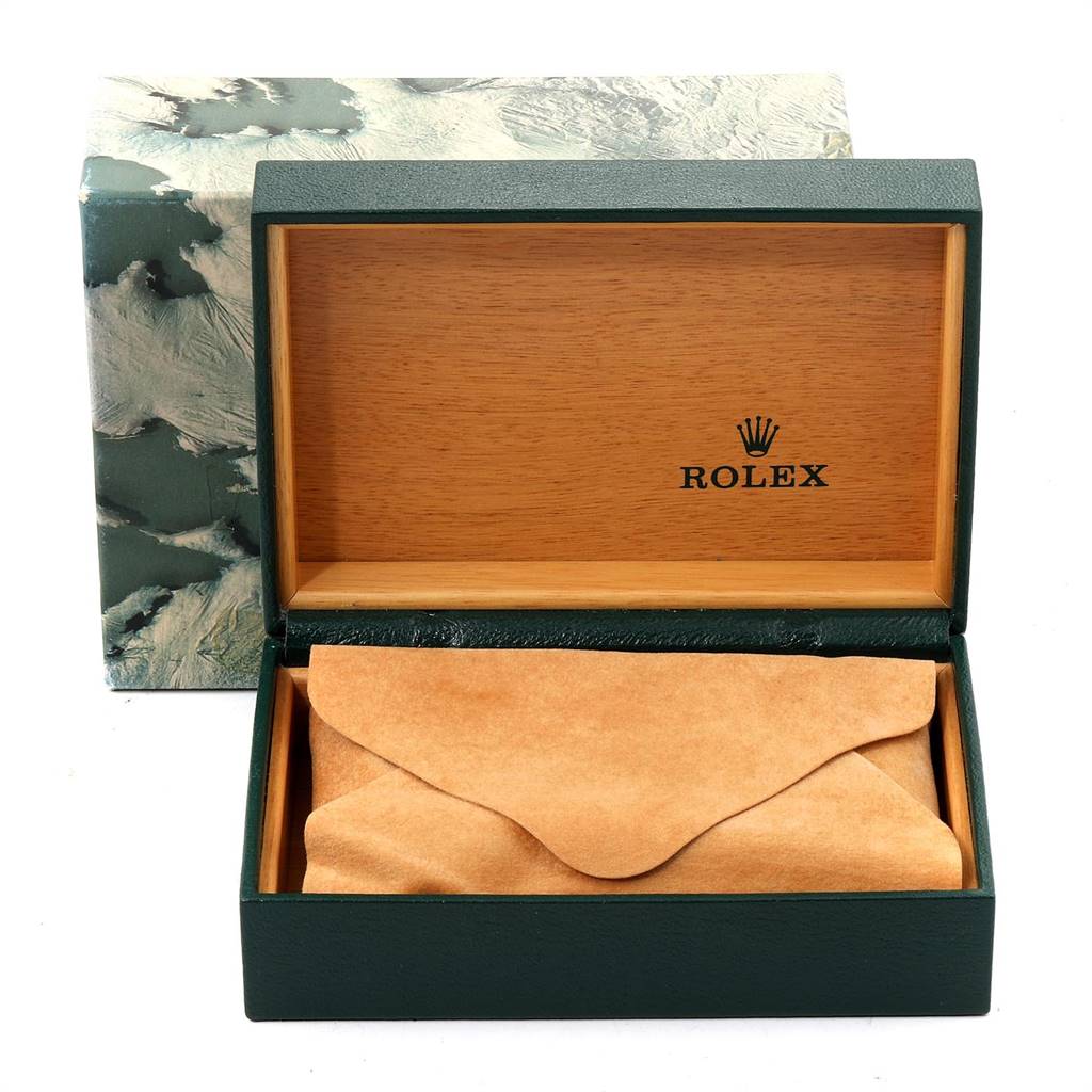 This image shows the open box of a Rolex Vintage Collection 1601 Men
s Steel and Gold (two tone) Silver Dial 1601 Men
s Steel and Gold (two tone) Silver Dial watch, revealing a leather pouch inside.