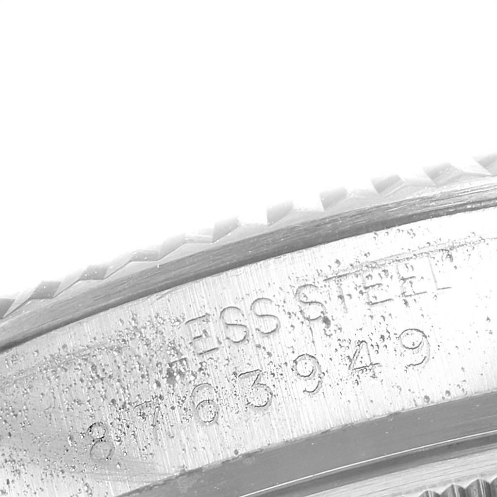 The image shows a close-up angle of the bezel and engraved case back of a Rolex Vintage Collection 16014 Men's Stainless Steel Silver Dial 16014 Men's Stainless Steel Silver Dial watch.