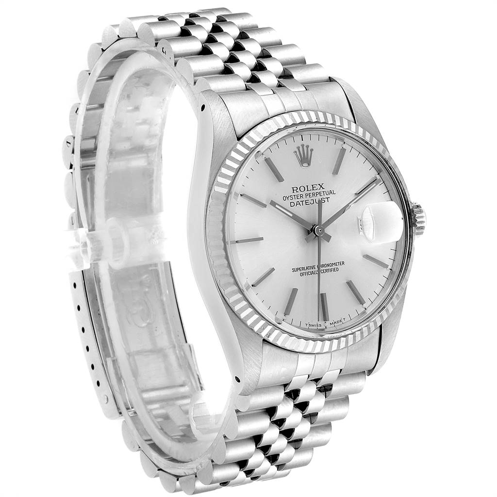 The Vintage Collection Rolex watch is shown at a three-quarter angle, highlighting the face, bezel, and metal bracelet.