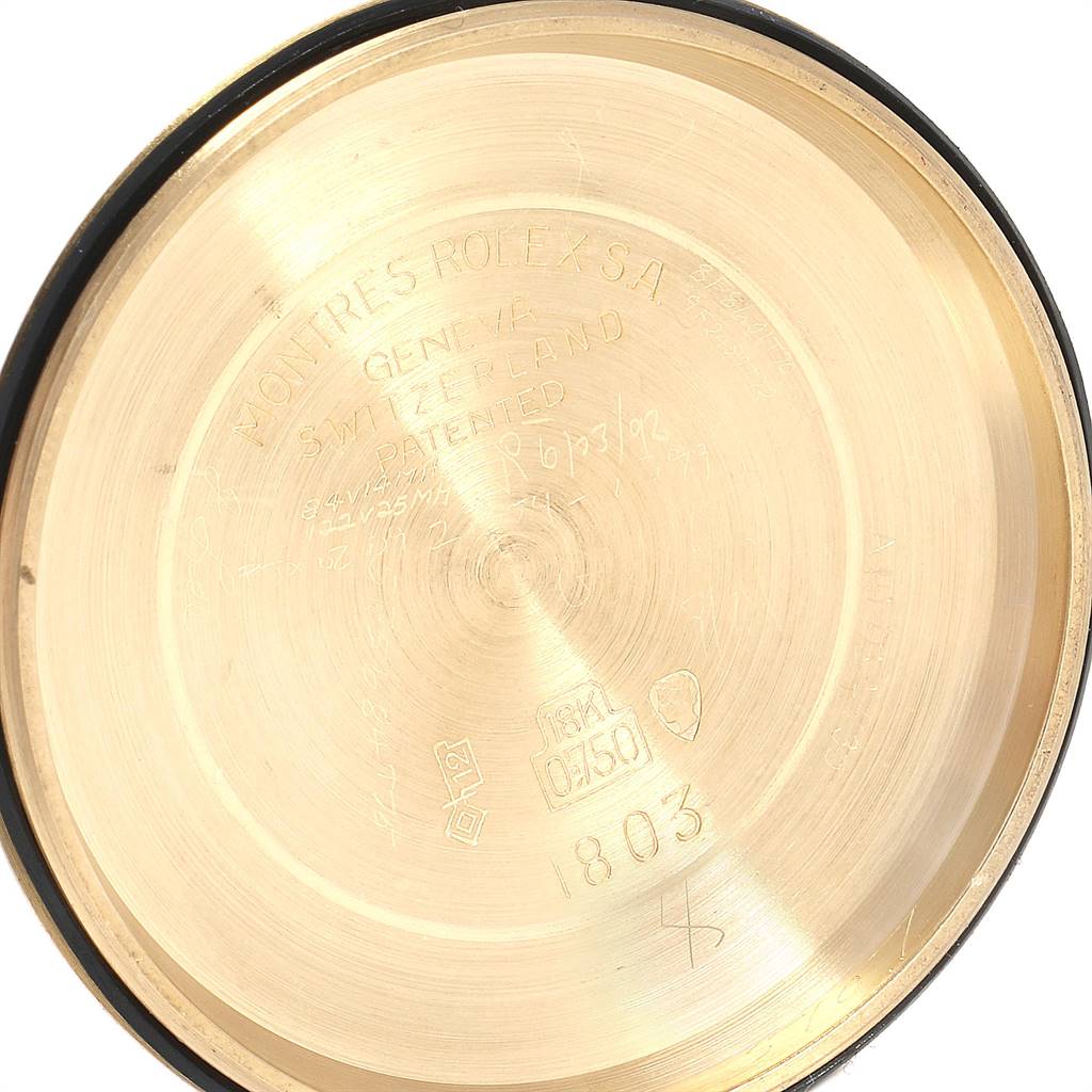 This image shows the inside of the case back for a Rolex Vintage Collection 1803 Men's Yellow Gold Black Dial 1803 Men's Yellow Gold Black Dial watch, displaying engravings and markings.