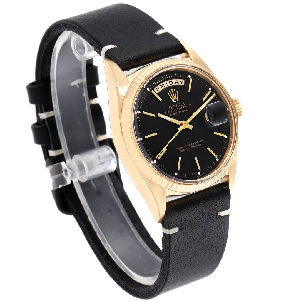 The Rolex Vintage Collection 1803 Men's Yellow Gold Black Dial 1803 Men's Yellow Gold Black Dial watch is shown at an angle highlighting the dial, bezel, crown, and black leather strap.