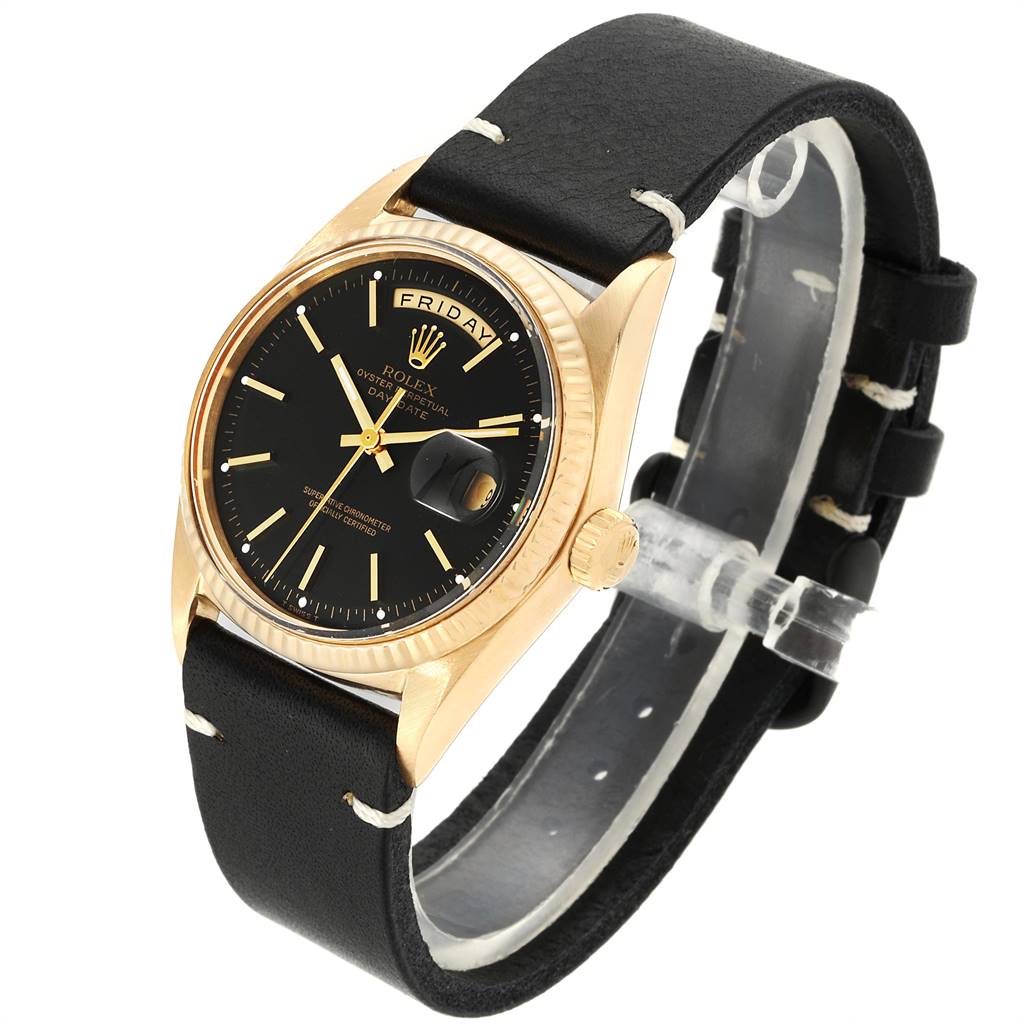 This image shows a Rolex Vintage Collection 1803 Men's Yellow Gold Black Dial 1803 Men's Yellow Gold Black Dial watch at a slight angle, highlighting the dial, crown, case, and leather strap.