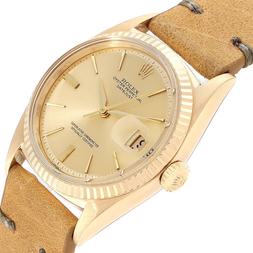 The image shows a close-up of a Rolex Vintage Collection 1601 Men's Yellow Gold Champagne Dial 1601 Men's Yellow Gold Champagne Dial model, displaying the dial, case, crown, and a portion of the strap.