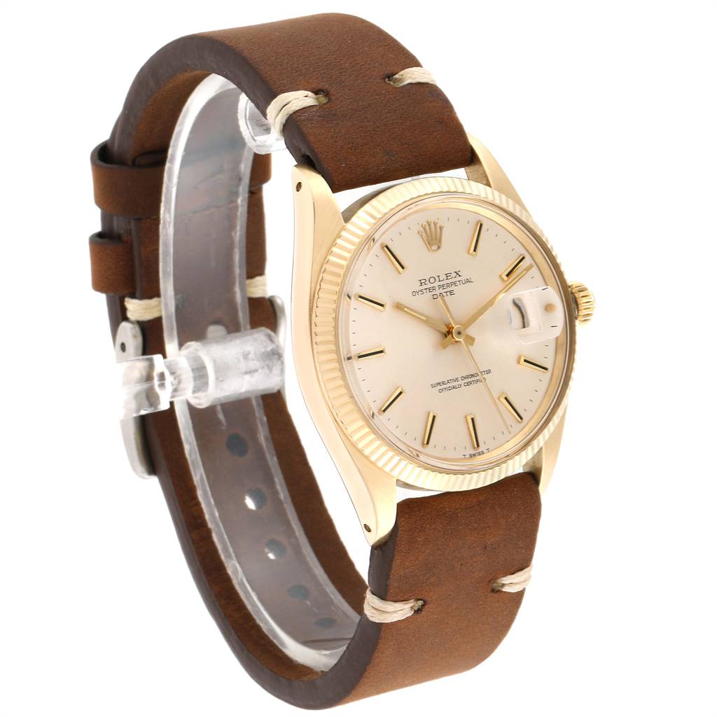 The Rolex Vintage Collection 1503 Men's Yellow Gold Silver Dial 1503 Men's Yellow Gold Silver Dial watch is shown from a 3/4 angle, highlighting its gold case, dial, and leather strap.