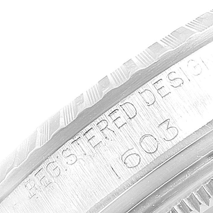 Close-up of the edge and engravings on a Rolex Vintage Collection 1603 Men
s Stainless Steel Black Dial 1603 Men
s Stainless Steel Black Dial model watch.