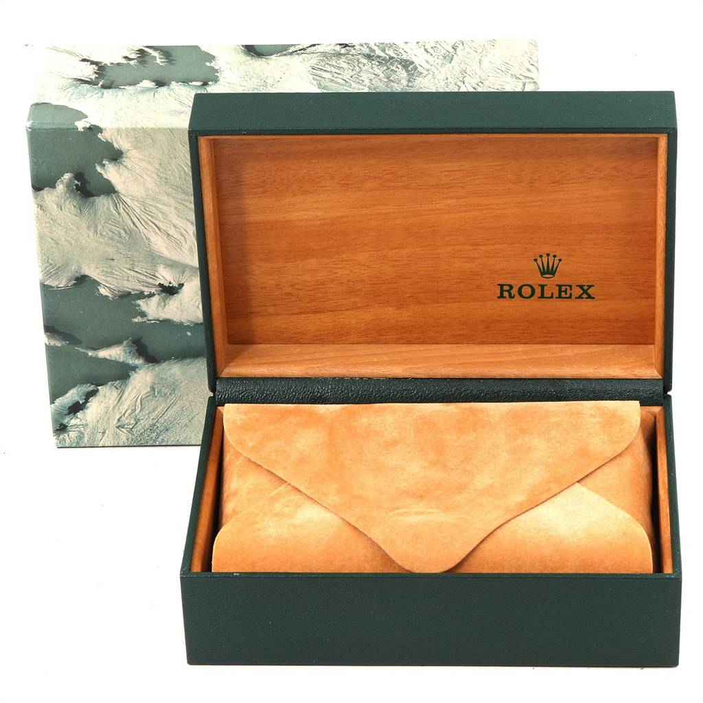 The image shows an open Rolex Vintage Collection 1603 Men
s Stainless Steel Black Dial 1603 Men
s Stainless Steel Black Dial watch box containing a tan suede pouch.