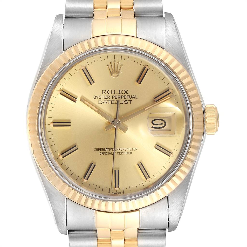This image shows the dial, bezel, and part of the band of a Rolex Vintage Collection 16013 Men's Stainless Steel Champagne Dial 16013 Men's Stainless Steel Champagne Dial Datejust watch viewed from the front.