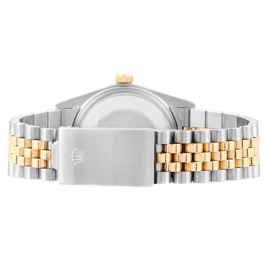 The image shows the back view of the Rolex Vintage Collection 16013 Men's Stainless Steel Champagne Dial 16013 Men's Stainless Steel Champagne Dial watch, focusing on its clasp and two-tone metal bracelet.