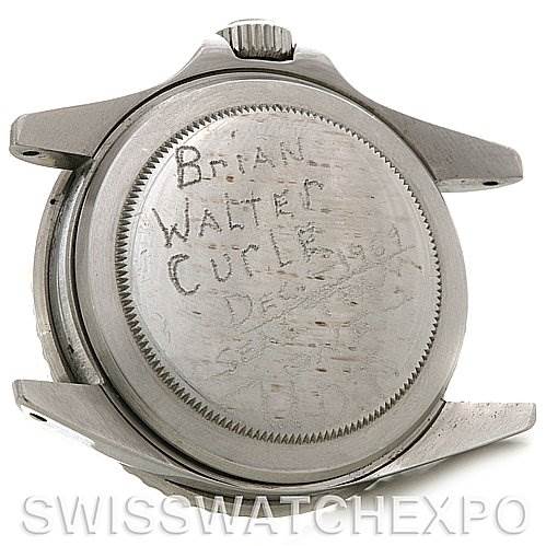 This image shows the back casing of a vintage Rolex Collection watch with engraved text.