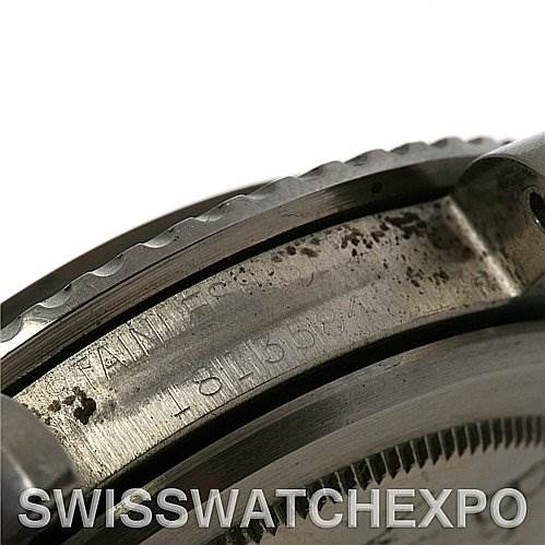 This image shows a close-up of the side of a Rolex Vintage Collection 1512 Men's Stainless Steel Black Dial 1512 Men's Stainless Steel Black Dial model, focusing on the engraved serial and model numbers.