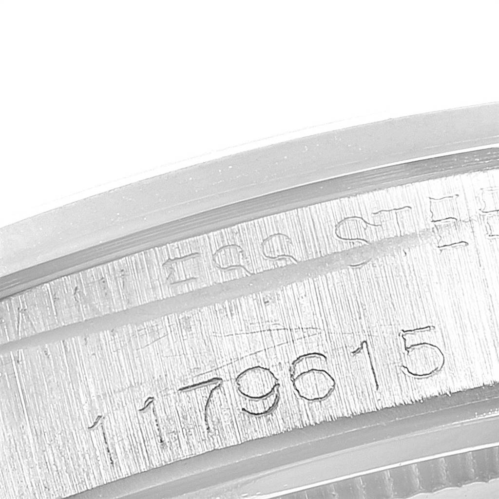 This close-up image shows the serial number and case details on the side of the Rolex Vintage Collection 6694 Men
s Stainless Steel Silver Dial 6694 Men
s Stainless Steel Silver Dial watch.
