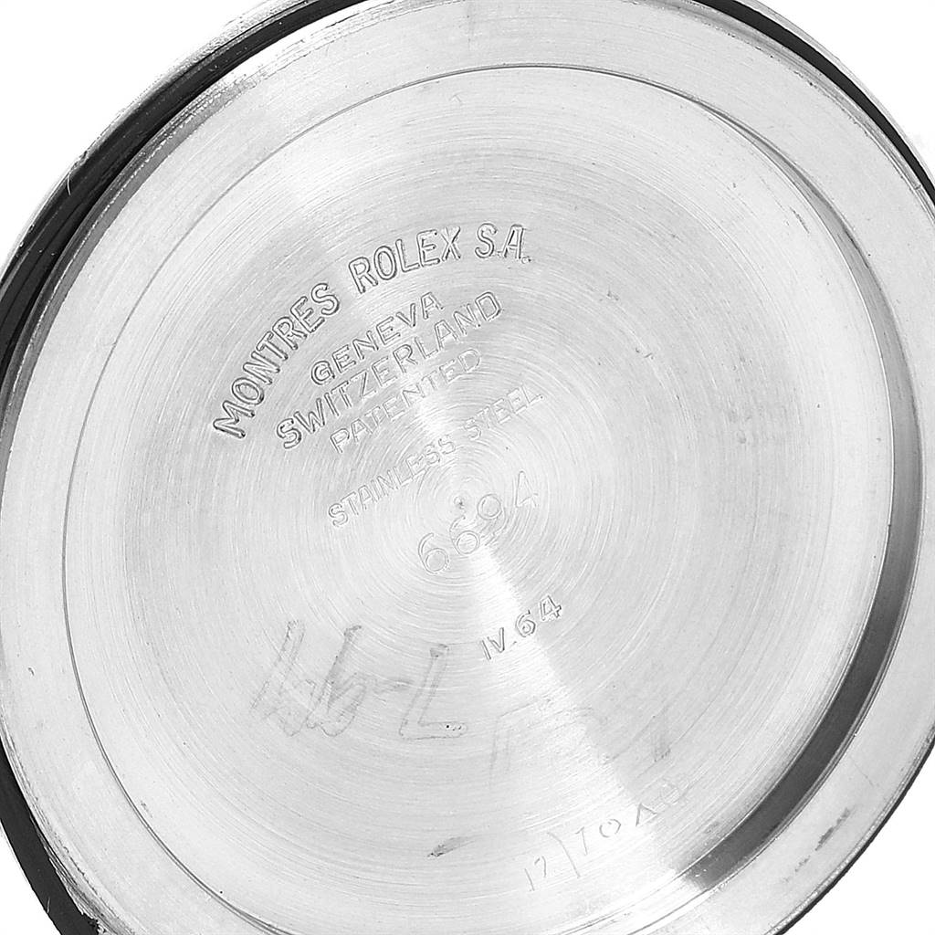 This image shows the backside of a Rolex Vintage Collection 6694 Men
s Stainless Steel Silver Dial 6694 Men
s Stainless Steel Silver Dial model watch case, featuring branding and specifications.