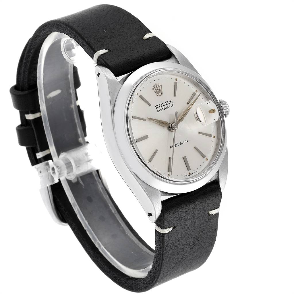 The image shows a Rolex Vintage Collection 6694 Men
s Stainless Steel Silver Dial 6694 Men
s Stainless Steel Silver Dial model watch at a three-quarter angle, highlighting the face, bezel, and leather strap.