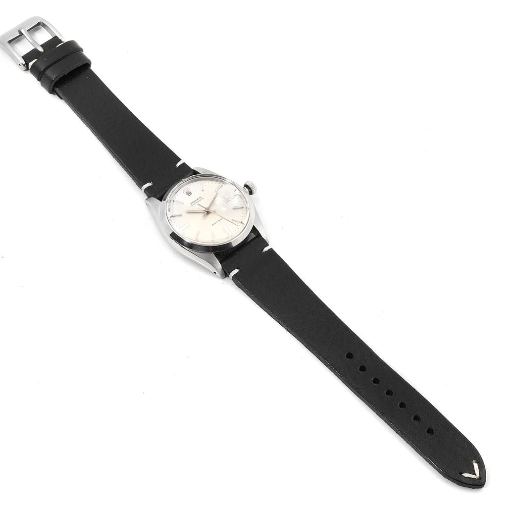 The Rolex Vintage Collection 6694 Men's Stainless Steel Silver Dial 6694 Men's Stainless Steel Silver Dial model watch is shown at a top-down angle, displaying its face, crown, and black leather strap.