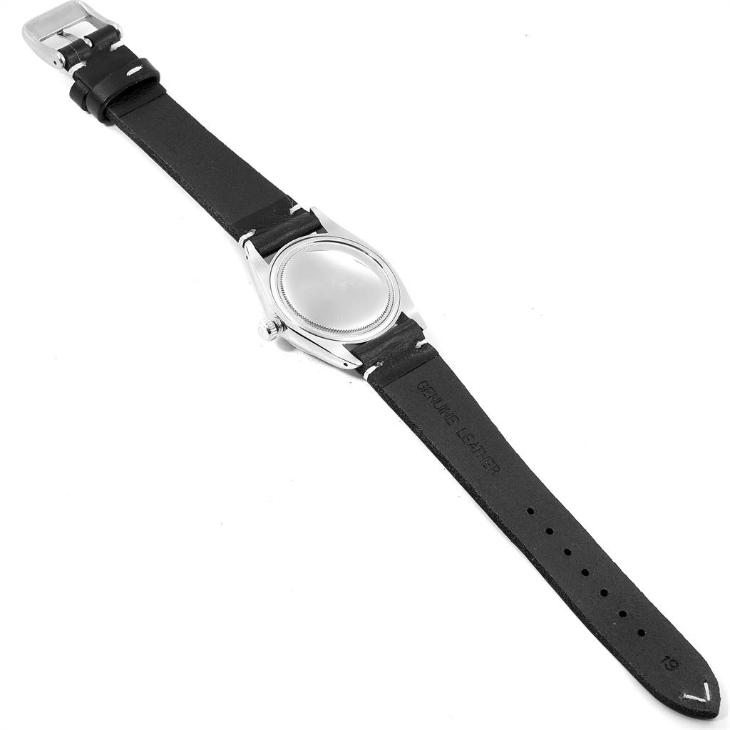 This image shows the back of the Rolex Vintage Collection 6694 Men's Stainless Steel Silver Dial 6694 Men's Stainless Steel Silver Dial watch lying flat, highlighting its black leather strap and stainless steel case.