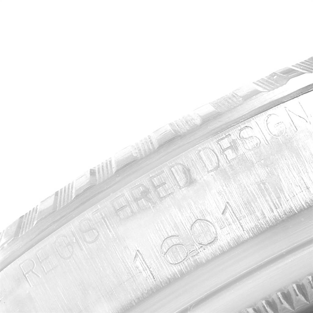 This close-up image shows the side engraving and edge texture of a Vintage Collection Rolex watch model 1601.