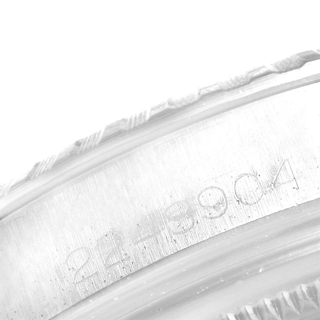 The image shows a close-up view of the outer edge and serial number of a Rolex Vintage Collection 1601 Men
s Stainless Steel Black Dial 1601 Men
s Stainless Steel Black Dial watch case.