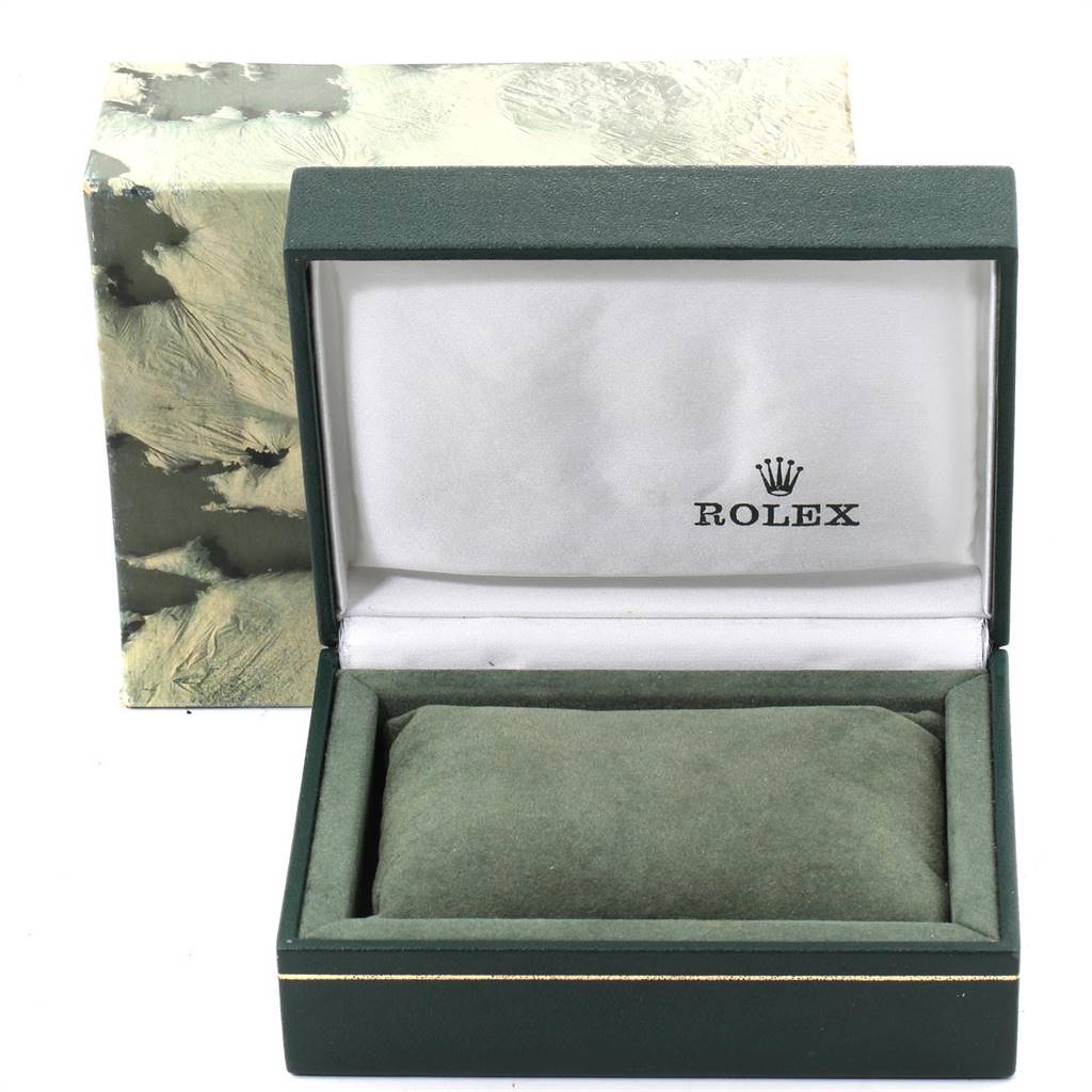 The image shows an open green Rolex watch box for a Vintage Collection model with a cushion and the logo inside.