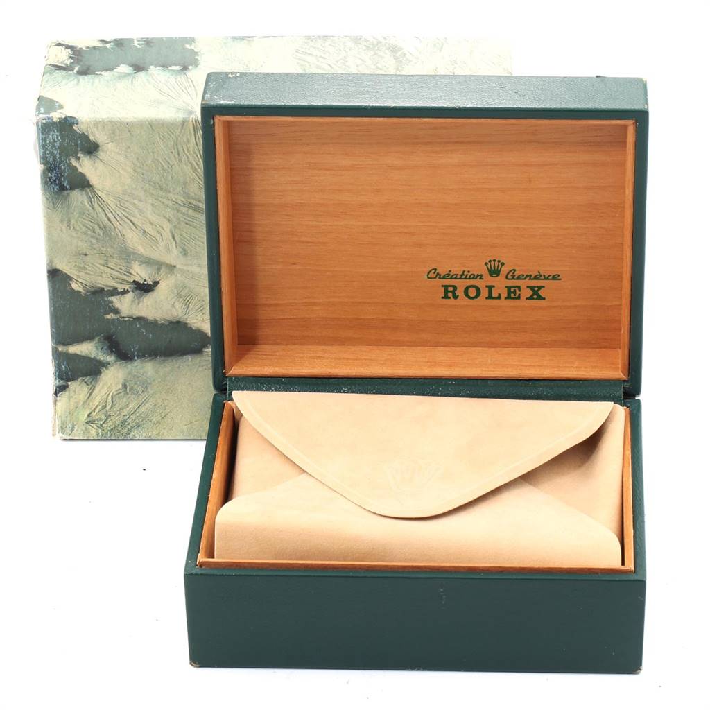 The image shows an open Rolex Vintage Collection 1601 Men's Stainless Steel Blue Dial 1601 Men's Stainless Steel Blue Dial watch box with the watch in a beige envelope.