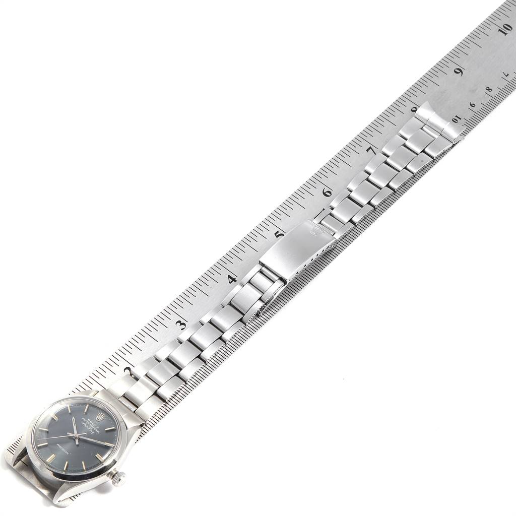 The image shows a Rolex Vintage Collection 5500 Men's Stainless Steel Grey Dial 5500 Men's Stainless Steel Grey Dial watch laid flat, measured against a ruler, with a focus on the face and metal bracelet.