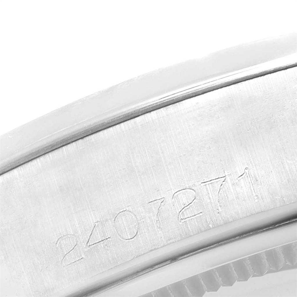 This image shows a close-up of the serial number engraved on the casing of a Rolex Vintage Collection 6694 Men's Stainless Steel Pink Dial 6694 Men's Stainless Steel Pink Dial watch.